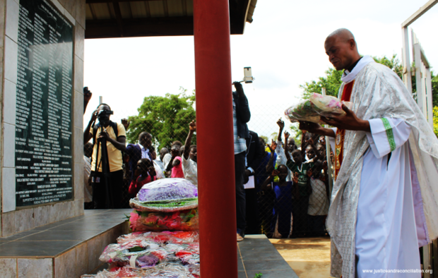 Laying a wreath at the memorial prayers for the Atiak massacre of 1995 on 20 April 2017. Credit: Patrick Odong/JRP.